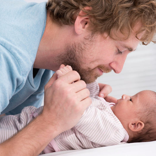 dad holding baby father's day